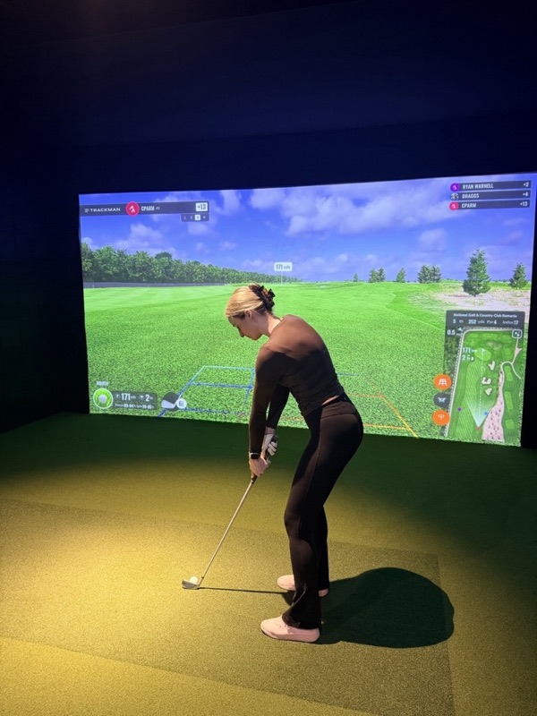 A golfer setting up a 171-yard approach shot on a TrackMan course